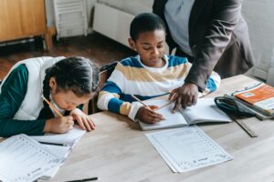 Black boy and Asian girl doing schoolwork