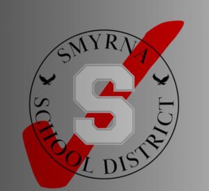 Smyrna School District badge with red check mark in the middle